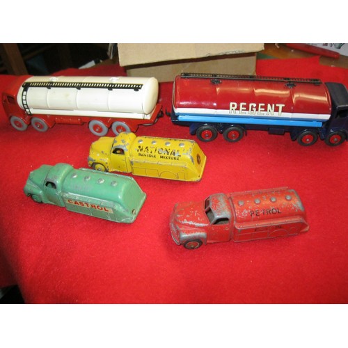 134 - A selection of vintage Dinky Toy petrol tankers comprising a pair of Foden 8-wheel tankers, repainte... 