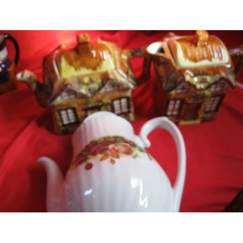 4 - Staffordshire Teapot Cream and sugar along with two cottage ware items a teapot and hot water along ... 