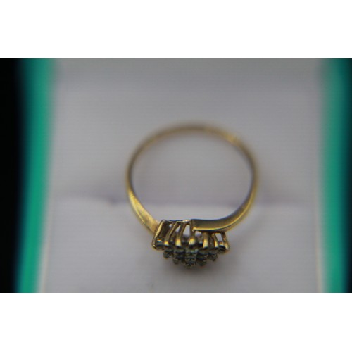 19 - A 9 carat gold diamond cluster ring, the cluster amounting to .25 carat, approx weight 1.9g, size P/... 