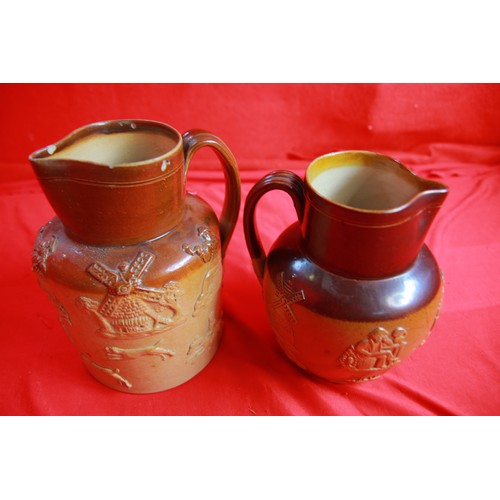 72 - A pair of early Doulton Lambeth jugs, one stamped, the other unstamped, minor a/f to rim on larger o... 