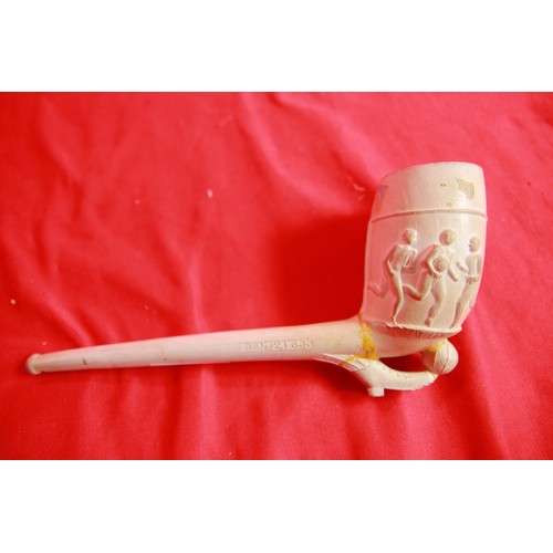 95 - A very large vintage clay pipe decorated with footballers, has been previously repaired but still an... 