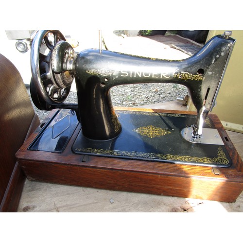 96 - An electric sewing machine built into a flip top table, and two other sewing machines