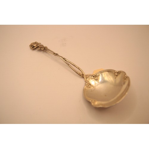 182 - A German .800 silver floral serving spoon with decoratively wrought handle, approx weight 43g