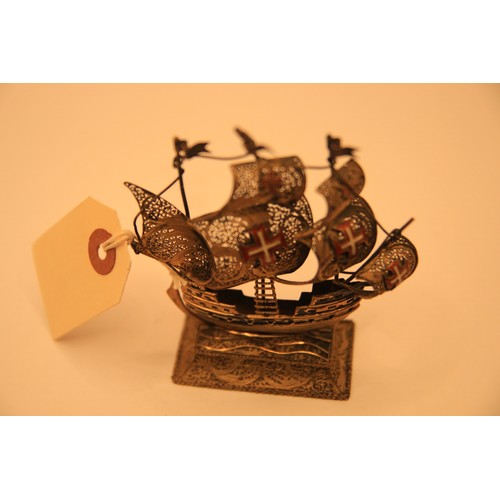 188 - A continental silver .835 filigree model of a galleon with enameled insignia to sails