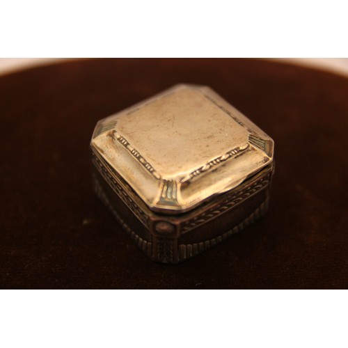 209 - An ornate continental silver (.800) snuff box with classical repousse decor