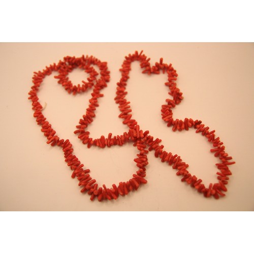 191 - A salmon red long branch coral necklace in good order