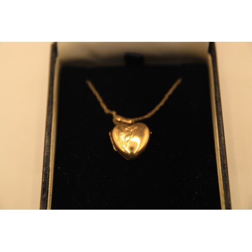 194 - A 9 carat gold heart-shaped locket on a gold chain, approx weight 2.3g