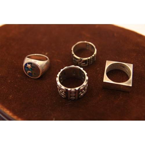 198 - 4 heavy and ornate silver rings, approx weight 42g