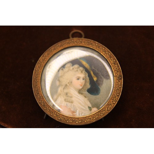 204 - A portrait miniature of a lady in an ornate frame