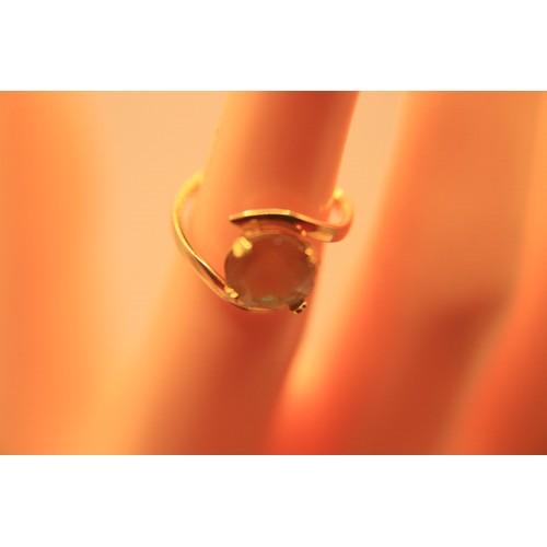 215 - A 10 carat gold fillet ring with solitaire saphiret, size L, approx weight 2.2g