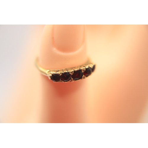 217 - A 9 carat gold 5 stone garnet ring, size O, approx weight 2.3g