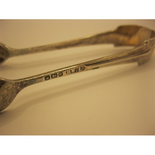 229 - A pair of sterling silver sugar tongs with art deco design to handle, hallmarked for Sheffield 1905 ... 