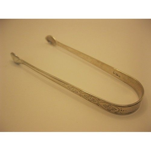 230 - A substantial pair of sugar tongs, hallmarked for London 1820, maker's mark largely polished away, f... 