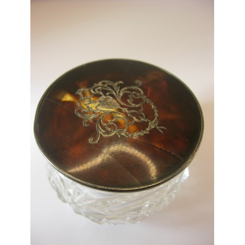 233 - A cut glass pot with tortoiseshell and sterling silver lid, hallmarked for London 1896 by Clifford B... 