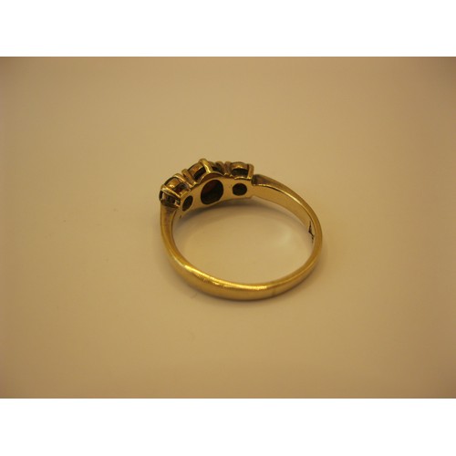 237 - A 9 carat gold ring set with three garnets, approx weight 2.8g, size O