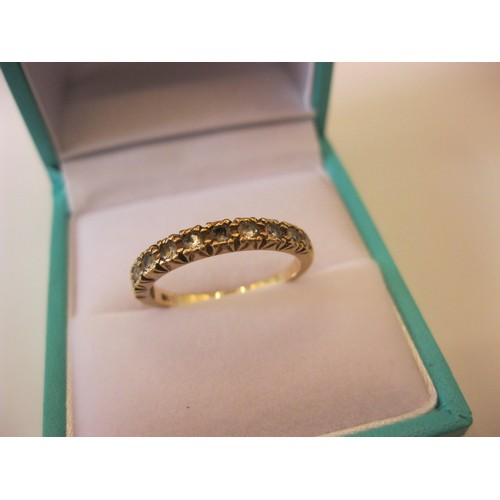 238 - A 9 carat gold ring set with clear rubies, approx weight 1.9g, size N/O