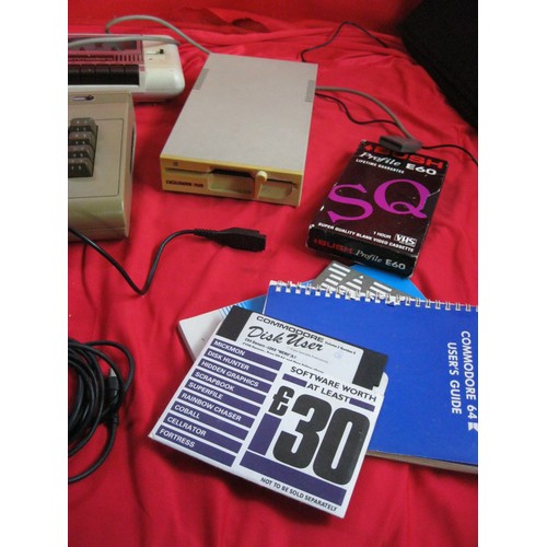 221 - A Commodore 64 vintage home computer system with power bricks, mouse, memory expansion cartridge, ta... 