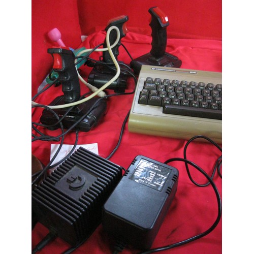 221 - A Commodore 64 vintage home computer system with power bricks, mouse, memory expansion cartridge, ta... 