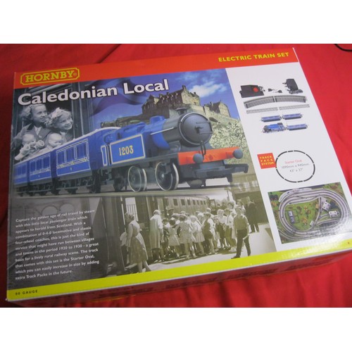 274 - A boxed Hornby R1016 Caledonian Local train set, complete, mint condition