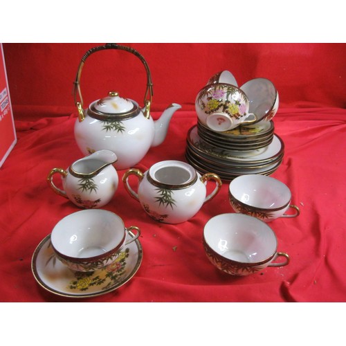 299 - A vintage Japanese tea service in good order