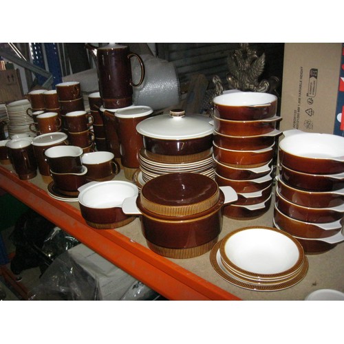 32 - A Poole Pottery Chestnut Dinner service with serving platters Plates Bowls etc.