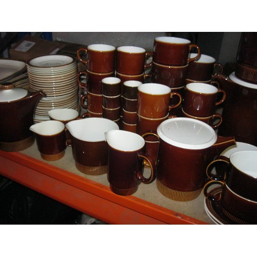 32 - A Poole Pottery Chestnut Dinner service with serving platters Plates Bowls etc.