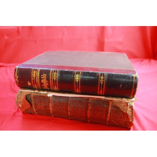 57 - A pair of large antique leather bound bibles