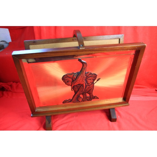 4 - A vintage copper magazine rack, with an elephant on one side and an antelope on the reverse.