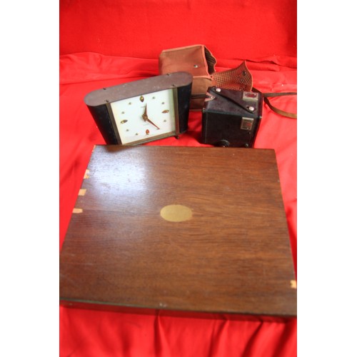 45 - A vintage clock awarded to a Weymouth fireman in the 1960s, a box brownie camera in case and a mainl... 