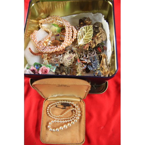 31 - A Tin of Costume Jewellery