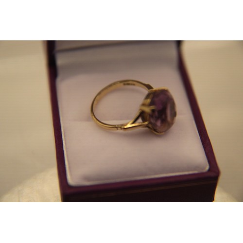 23 - A 9 carat gold ring set with a large amethyst, approx weight 3.8g, size O/P