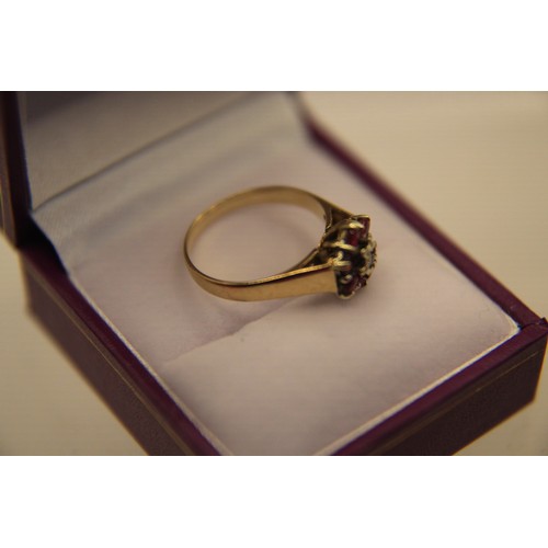 24 - A 9 carat gold ring set with a central diamond surrounded by  a cluster of 6 amethysts, approx weigh... 