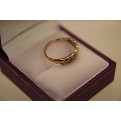 27 - A 9 carat gold ring set with zirconiums, approx weight 1.64g, size P