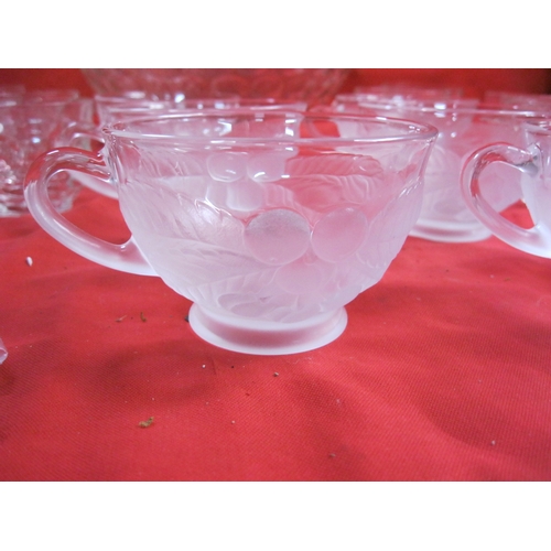 140 - A large punchbowl with 12 matching glasses and hooks to hang from edge of bowl, plus a further 6 gla... 