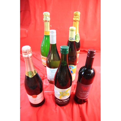 210 - 4 bottles of wine including one of Mulled Wine, 2 bottles of Buck's Fizz and a bottle of Rose Spuman... 