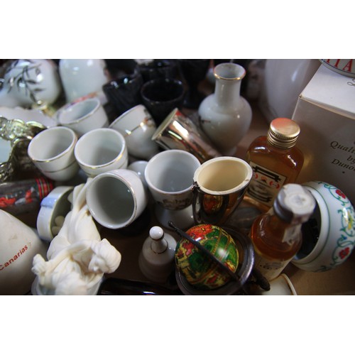 170 - A large tray of assorted ceramics ,Glass etc to include eggcups ,Glass ornaments ,two boots and a wh... 