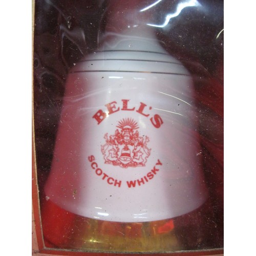 217 - A pair of Wade commemorative decanters of Bell's Whisky, both full and sealed, boxed but boxes a/f