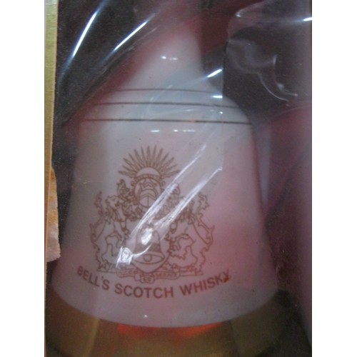 217 - A pair of Wade commemorative decanters of Bell's Whisky, both full and sealed, boxed but boxes a/f