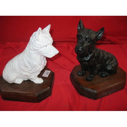 216 - A pair of vintage Black & White Whisky advertising dogs on wooden plinths, the dogs of spelter