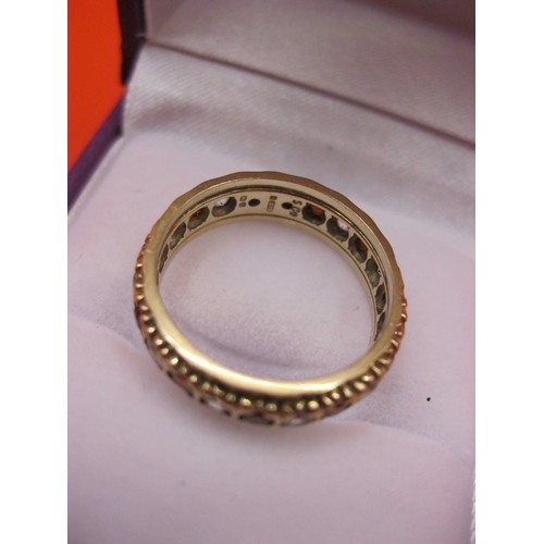 239 - A 9 cart gold ring hallmarked for Birmingham set with red and clear stones, possibly garnet and zirc... 