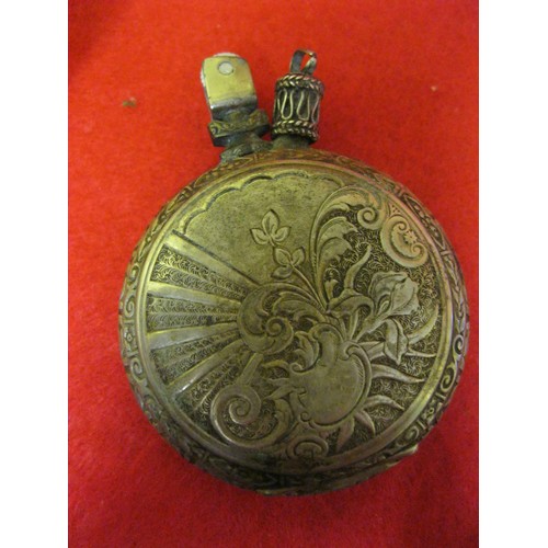 322 - A petrol lighter made from a pocket watch case, the exterior bearing the Parteiadler of the NSDAP ab... 