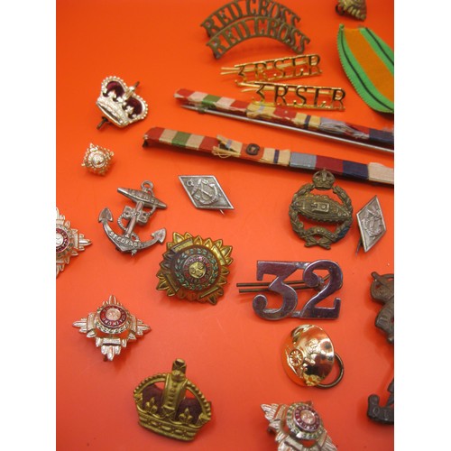 362 - A small collection of military items including Dorset Regt and other shoulder titles in brass, a Mil... 