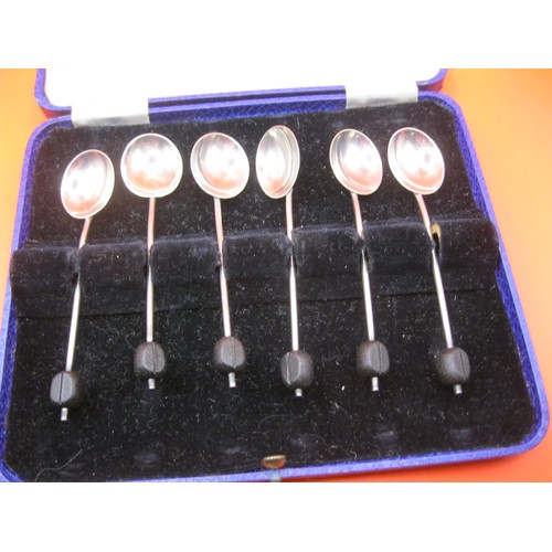 368 - A cased set of silver bean terminal coffee spoons