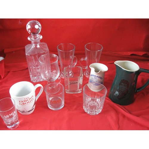 394 - A selection of branded whisky jugs and whisky glasses plus a decanter