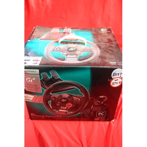 73 - A boxed Logitech steering wheel/pedals set