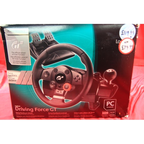 73 - A boxed Logitech steering wheel/pedals set