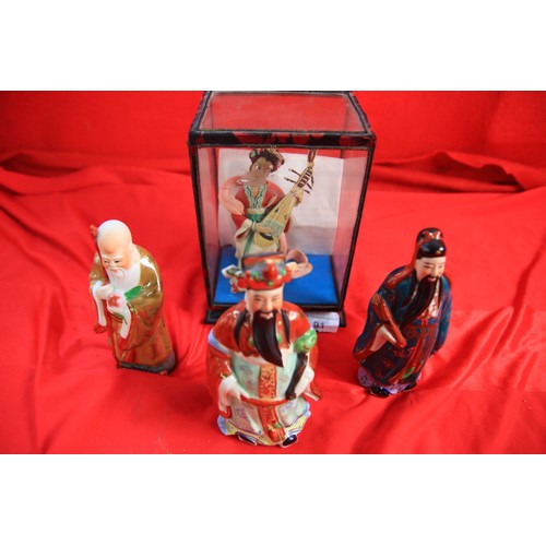 74 - Oriental Figure in glass case,  plus other uncased figures