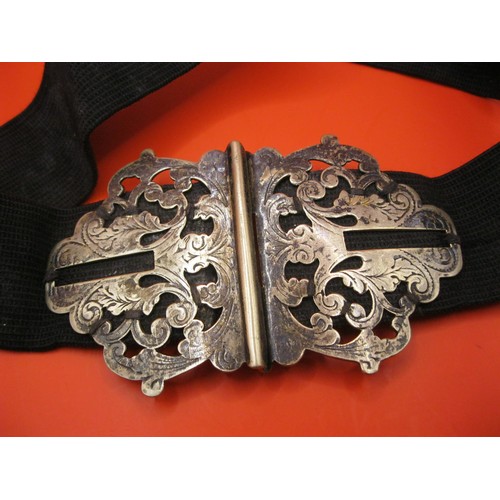 97 - An ornate nurses buckle, believed silver plate but of good quality, on a vintage elasticated nurse's... 