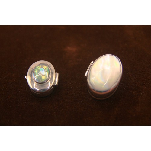 59 - A pair of sterling silver pill- or snuff-boxes, one with a white stone set to lid, the other with so... 