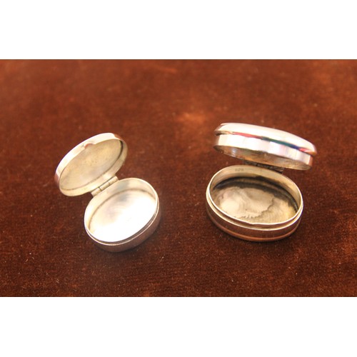 59 - A pair of sterling silver pill- or snuff-boxes, one with a white stone set to lid, the other with so... 